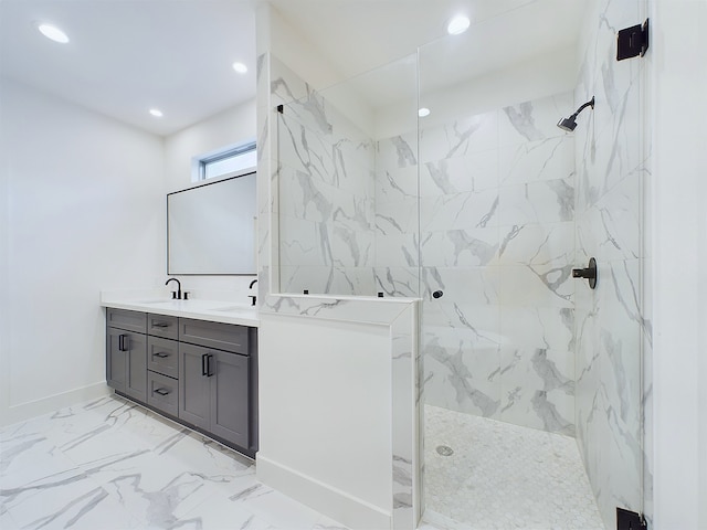 bathroom with vanity and tiled shower