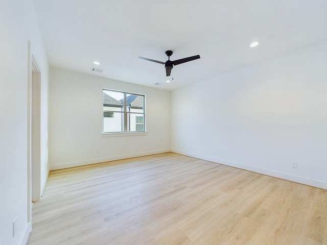 unfurnished room with light hardwood / wood-style floors and ceiling fan