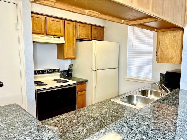 kitchen with sink and white appliances