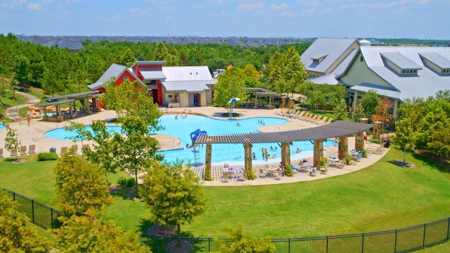 view of swimming pool with a lawn and a patio