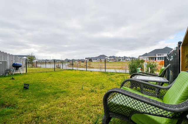 view of yard with a water view