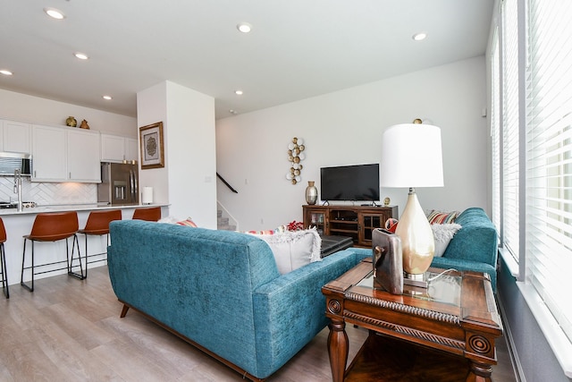 living room with light hardwood / wood-style floors