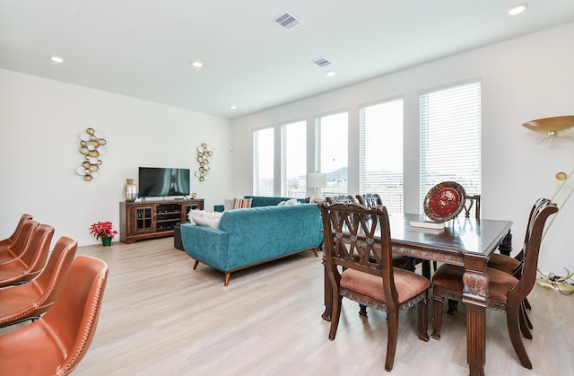 dining area with light hardwood / wood-style floors