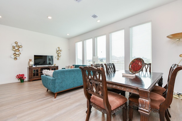 dining area featuring light wood-type flooring