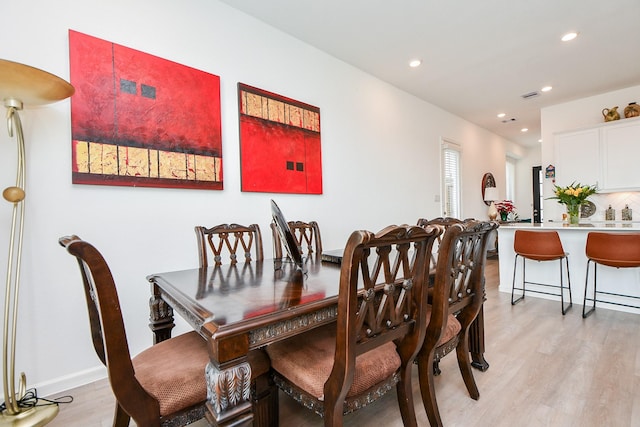 dining room with light hardwood / wood-style flooring