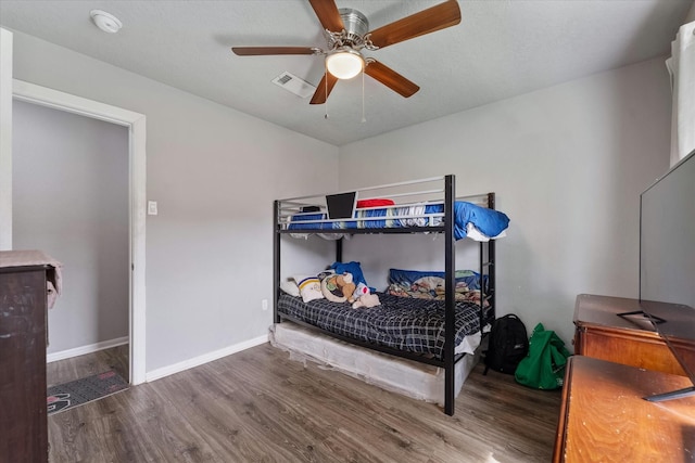 bedroom featuring ceiling fan and hardwood / wood-style flooring