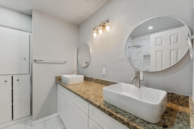 bathroom featuring vanity and walk in shower