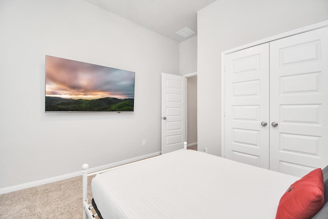 carpeted bedroom featuring a closet