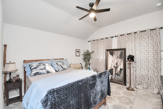 bedroom with ceiling fan, light carpet, and vaulted ceiling