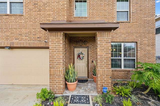 view of exterior entry with a garage