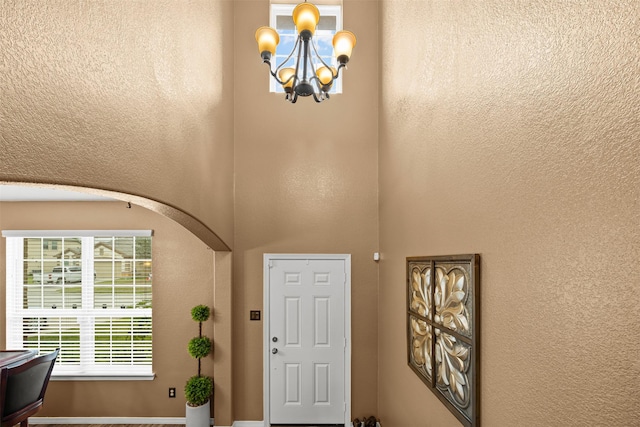 entryway featuring a chandelier