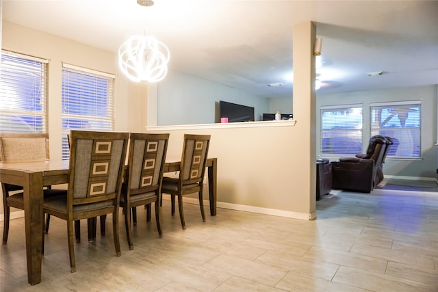 dining room featuring a notable chandelier