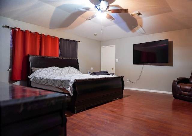 bedroom with hardwood / wood-style floors and ceiling fan