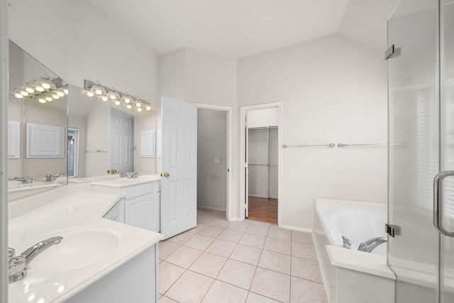 bathroom with plus walk in shower, vanity, tile patterned floors, and lofted ceiling