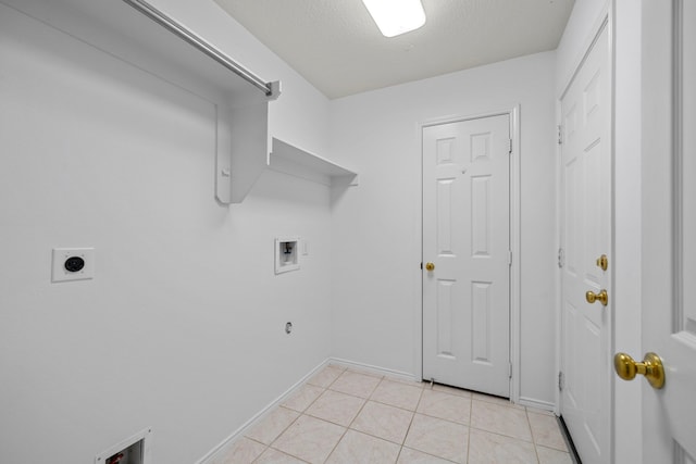 laundry room with hookup for a washing machine, hookup for a gas dryer, electric dryer hookup, and light tile patterned flooring