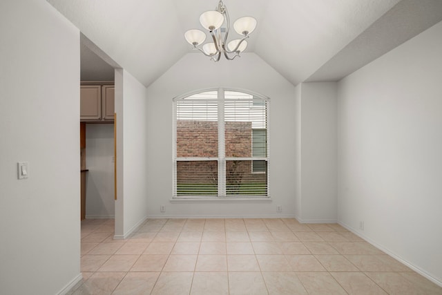 unfurnished dining area with light tile patterned floors, lofted ceiling, and a notable chandelier