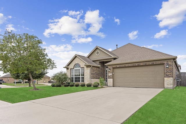 view of front of house featuring a front lawn and a garage