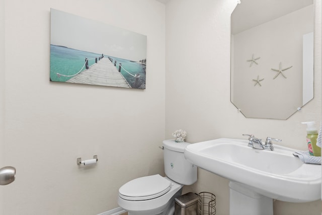 bathroom with sink and toilet