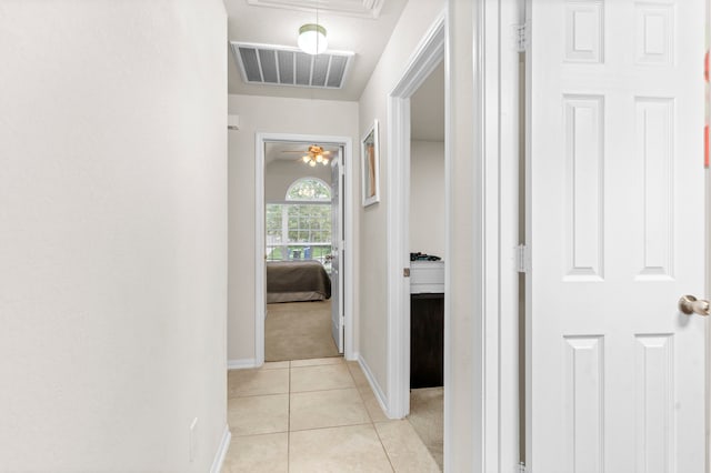 hall featuring light tile patterned flooring