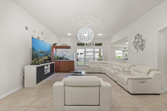 tiled living room featuring a notable chandelier