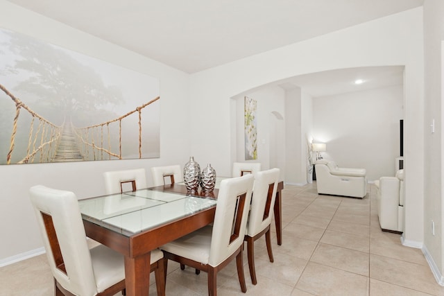 dining space with light tile patterned floors