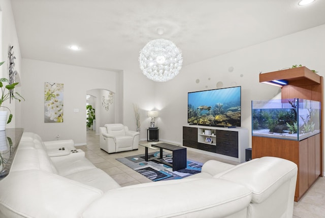 living room with an inviting chandelier and light tile patterned floors