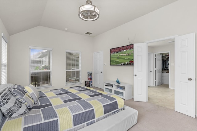 bedroom with lofted ceiling and carpet flooring