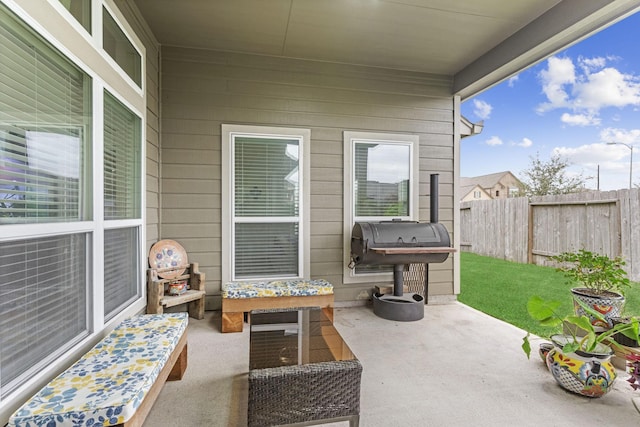 view of patio featuring a grill