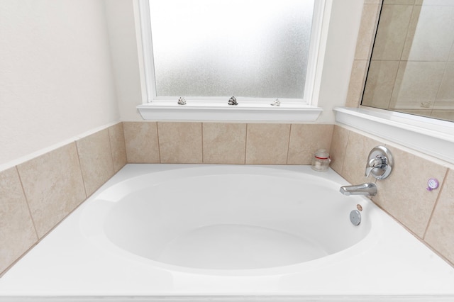 bathroom featuring a tub to relax in