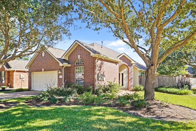 view of front facade with a garage and a front yard