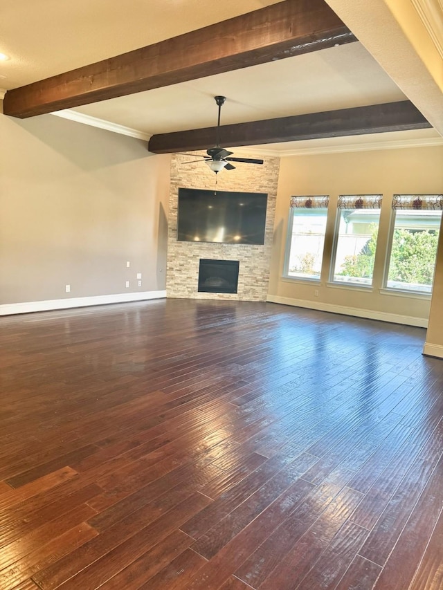 unfurnished living room featuring a stone fireplace, ceiling fan, and dark hardwood / wood-style floors