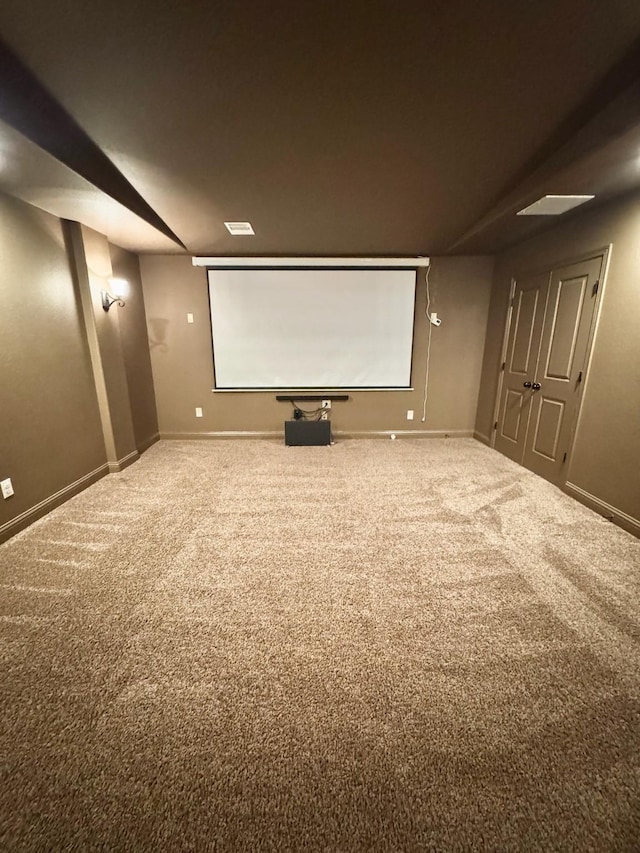 cinema with carpet and baseboards