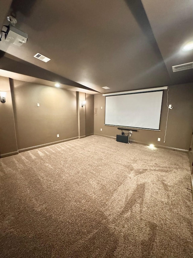 carpeted cinema room featuring baseboards and visible vents