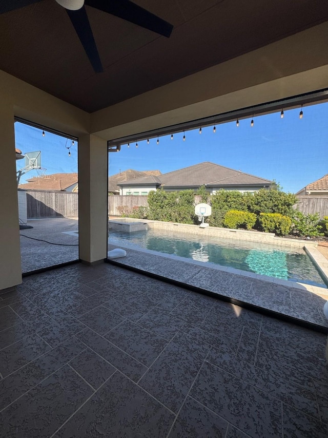 view of patio / terrace featuring a fenced backyard and a ceiling fan