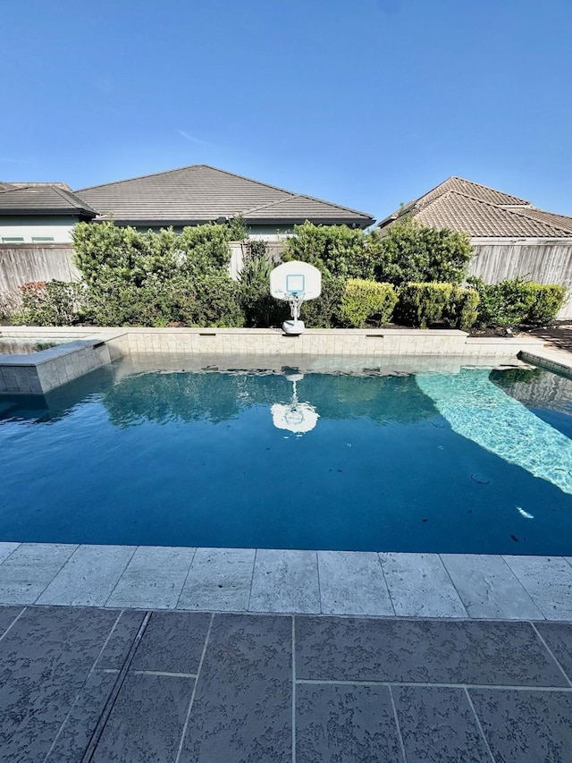 view of pool with fence