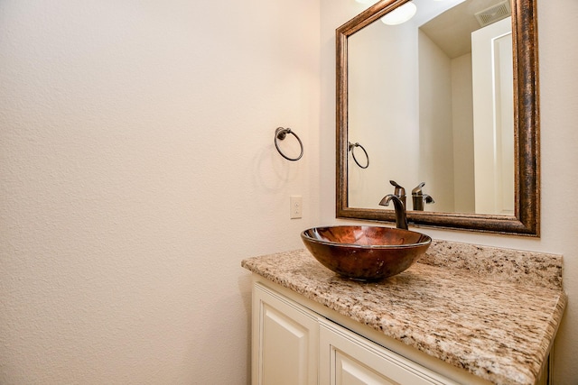 bathroom featuring visible vents and vanity