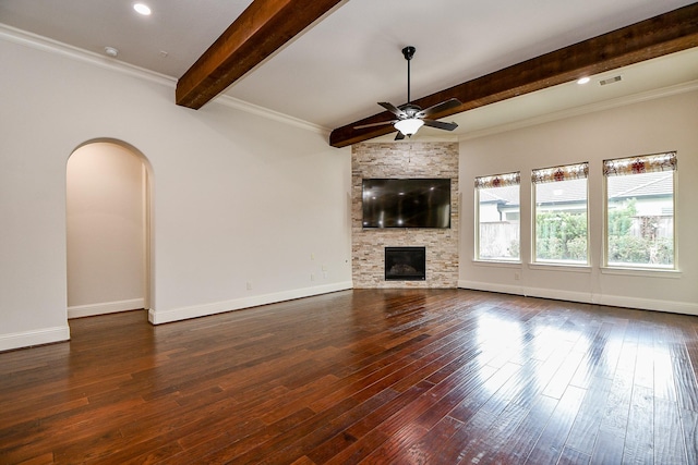 unfurnished living room featuring ceiling fan, arched walkways, a fireplace, visible vents, and dark wood finished floors