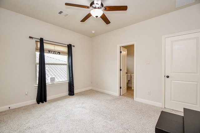 unfurnished bedroom with light carpet, baseboards, and visible vents