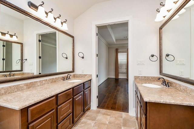 full bathroom featuring lofted ceiling, tile patterned flooring, and vanity