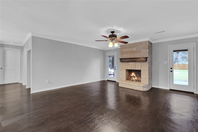 unfurnished living room with a fireplace, ceiling fan, dark hardwood / wood-style flooring, and crown molding