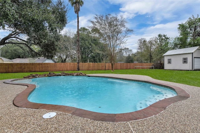 view of pool featuring a yard and an outdoor structure