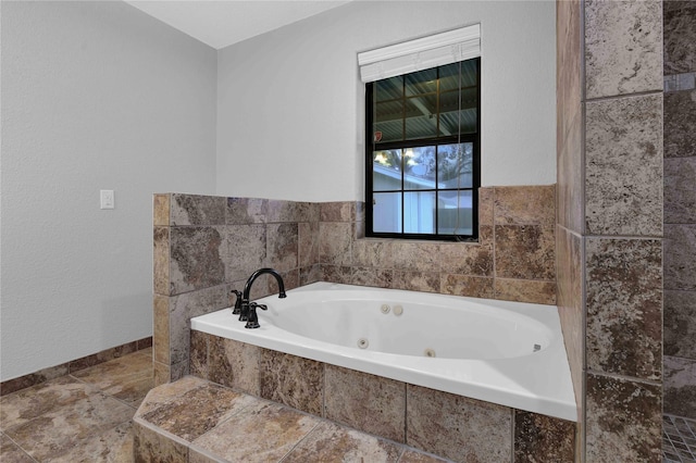 bathroom featuring tiled bath