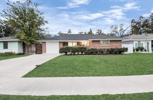 ranch-style house with a front lawn