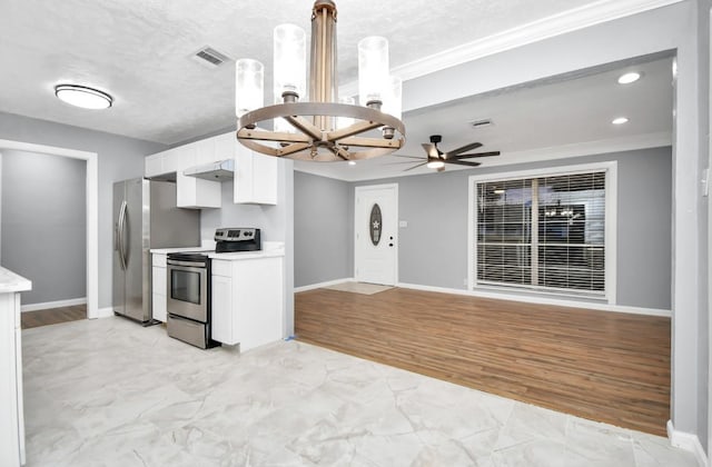 kitchen with white cabinets, ceiling fan with notable chandelier, light wood-type flooring, ornamental molding, and stainless steel appliances