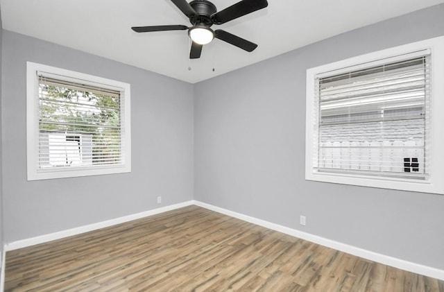 unfurnished room featuring hardwood / wood-style floors and ceiling fan