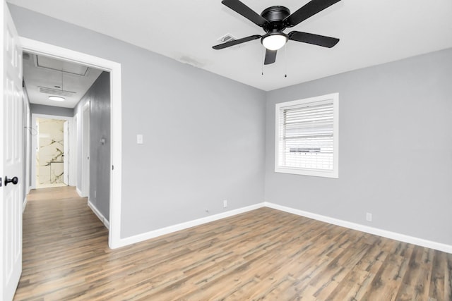 unfurnished room with wood-type flooring and ceiling fan