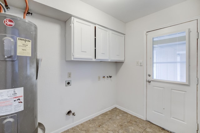 clothes washing area featuring cabinets, light tile patterned floors, gas dryer hookup, and water heater