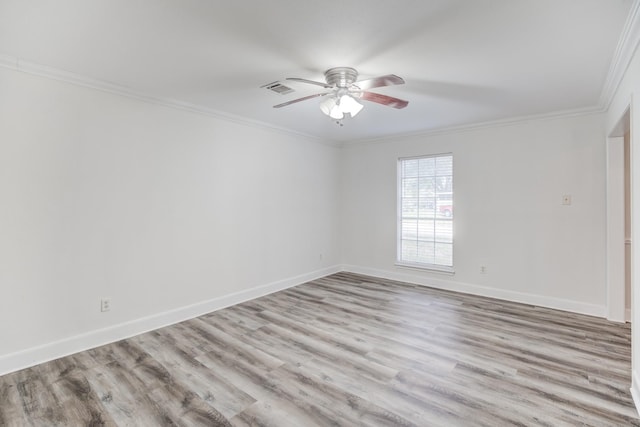 empty room with ceiling fan, crown molding, and light hardwood / wood-style flooring