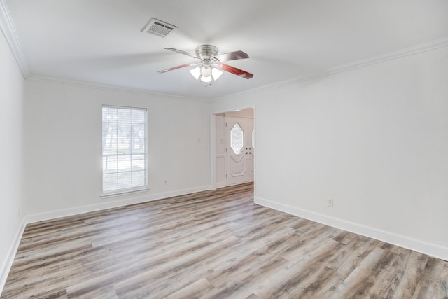 unfurnished room with ceiling fan, ornamental molding, and light wood-type flooring