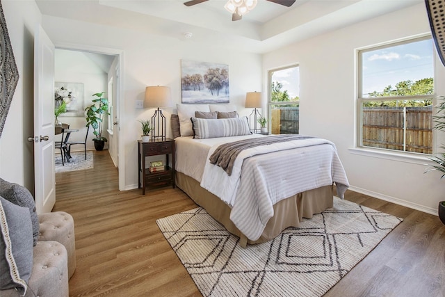 bedroom with hardwood / wood-style floors and ceiling fan